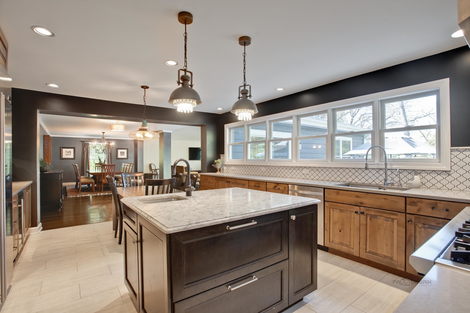 20890 West Exeter Road Kildeer, IL 60047 - Photo 27 of 62 a kitchen with a stove sink and living room view
