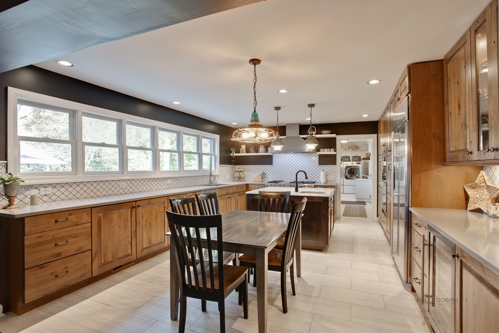 20890 West Exeter Road Kildeer, IL 60047 - Photo 30 of 62 a dining area with stainless steel appliances granite countertop a kitchen island a stove a table and chairs