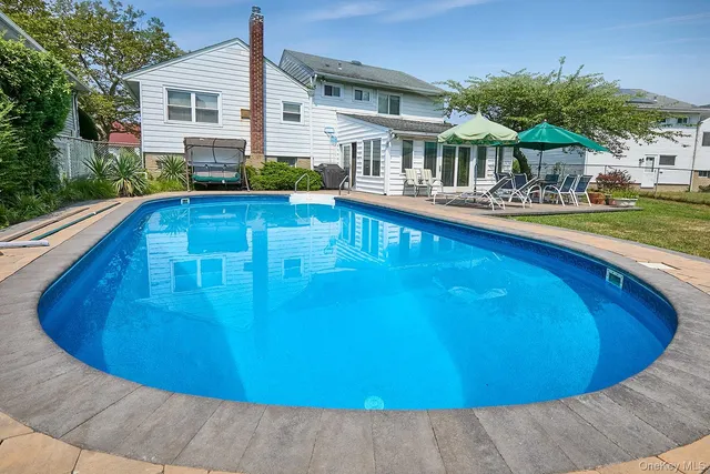 a view of a house with swimming pool