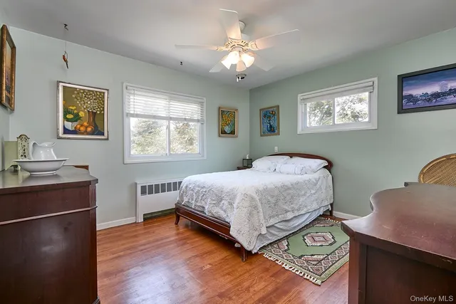 a bedroom with a bed and a desk