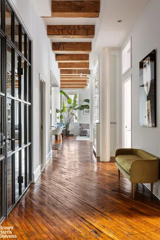 a view of front door with wooden floor