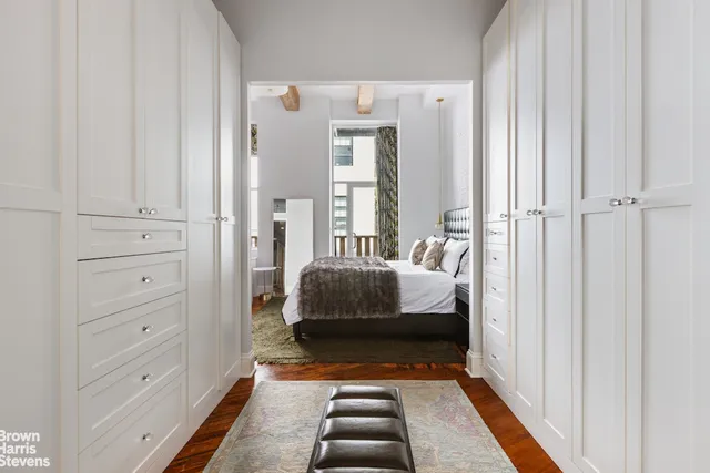 a view of a kitchen with wooden floor and a sink