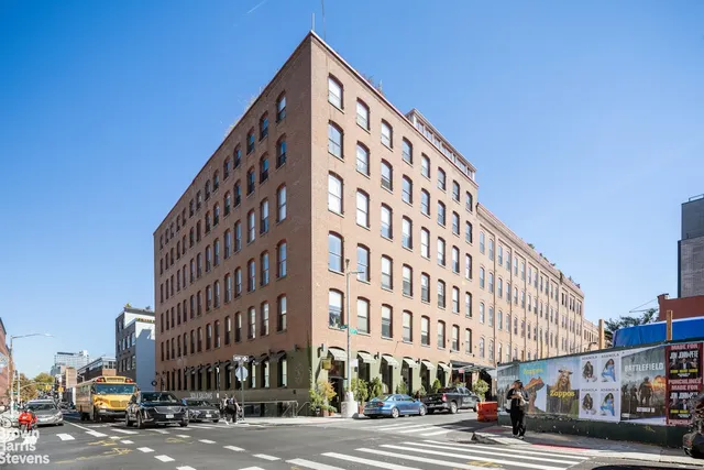a view of a building with a street