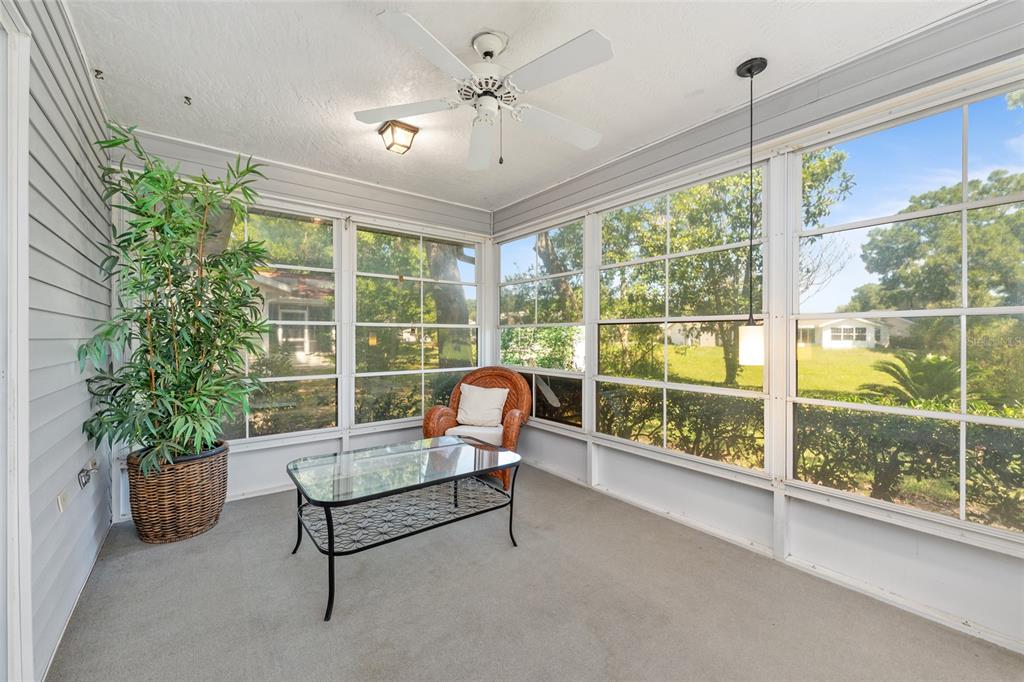 8038 Southwest 108th Loop Ocala, FL 34481 - Photo 30 of 48 a living room with furniture and potted plants
