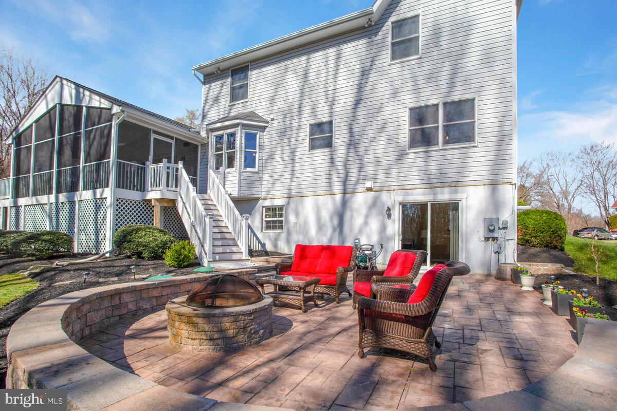 9731 Howes Road Dunkirk, MD 20754 - Photo 56 of 58 Stamped concrete patio w/ fire pit and lights