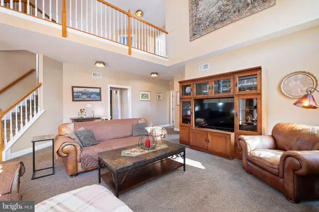 a view of a livingroom with furniture and windows