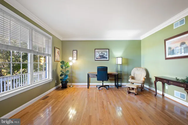 a bath tub sitting in a bathroom next to a window