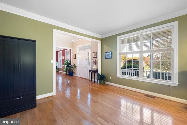 a view of a workspace with furniture and a bedroom