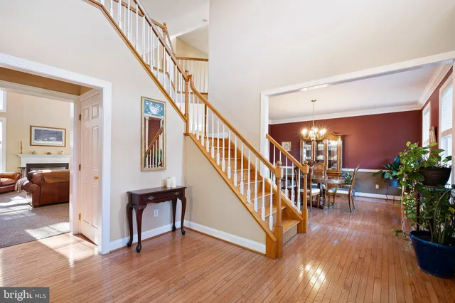 a dining room with furniture a livingroom and chandelier