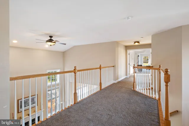 a dining room with a wooden table and chairs