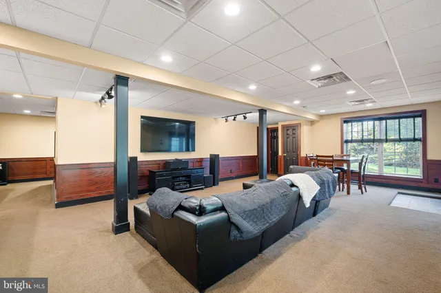 an aerial view of a house with a swimming pool yard and outdoor seating