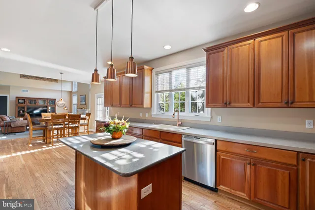 a living room with furniture fireplace and a table