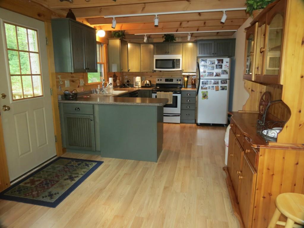 90 Big Woods Road Harrison, ME 04040 - Photo 11 of 34 View from dining room into kitchen