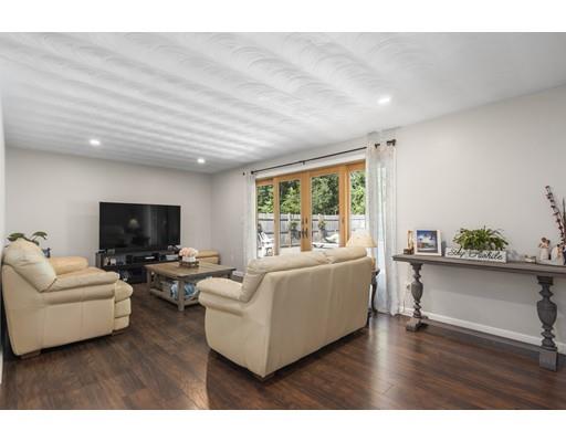 5 Samuel Road Chelmsford, MA 01824 - Photo 4 of 17 a living room with furniture and a flat screen tv