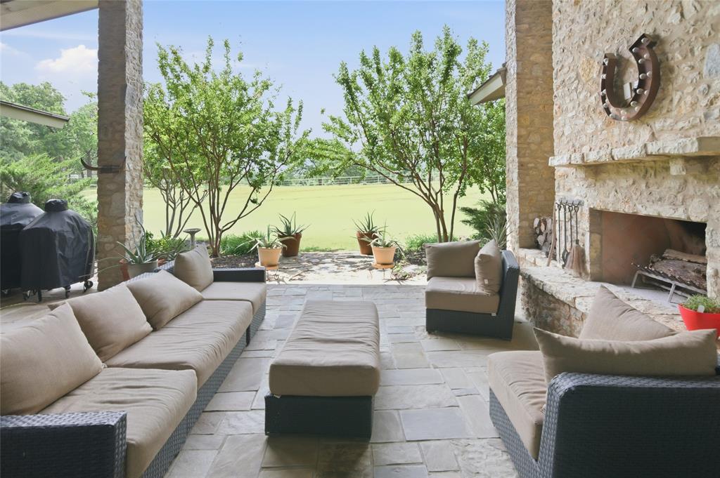 1138 Bancroft Road Keller, TX 76248 - Photo 32 of 39 Spacious covered patio featuring stone flooring and columns