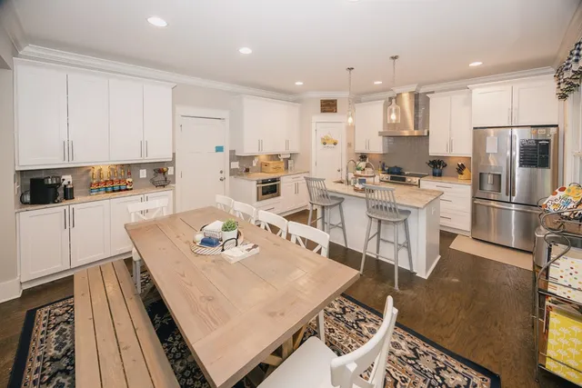 a living room with lots of furniture and a chandelier