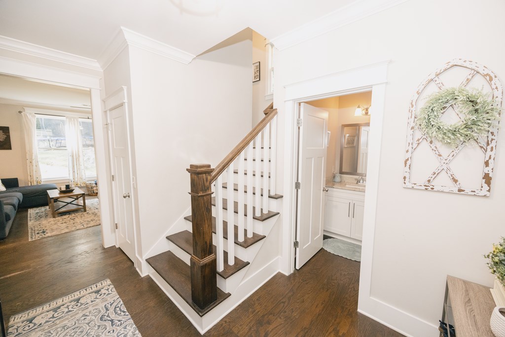 3232 Hillside Way Columbus, GA 31906 - Photo 24 of 61 a view of a hallway with wooden floor and stairs