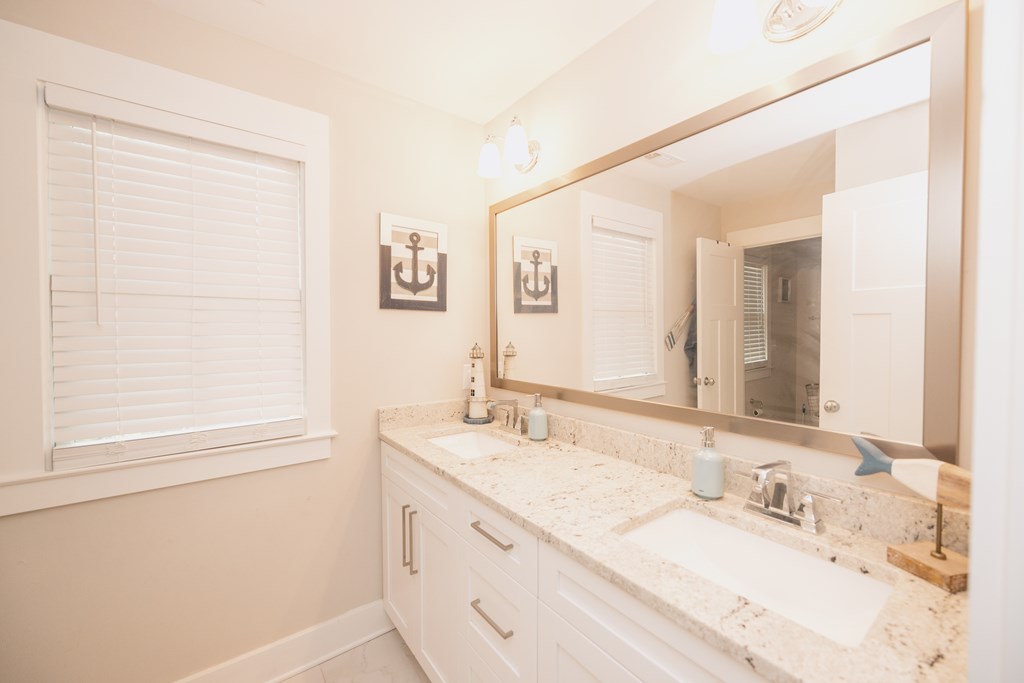 3232 Hillside Way Columbus, GA 31906 - Photo 46 of 61 a bathroom with a granite countertop sink a mirror and a