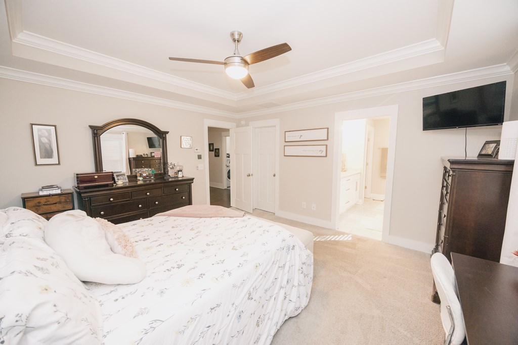 3232 Hillside Way Columbus, GA 31906 - Photo 49 of 61 a large bedroom with a bed and a flat screen tv