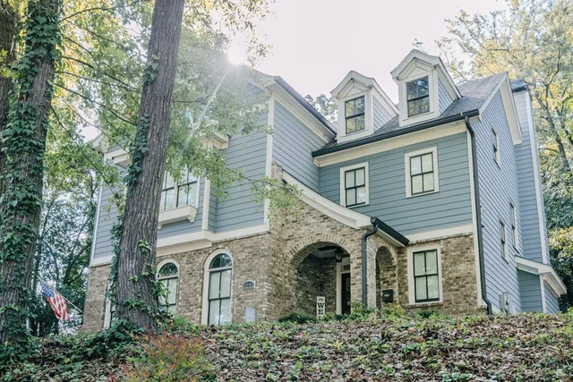 a front view of a house with garden