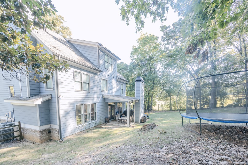 3232 Hillside Way Columbus, GA 31906 - Photo 54 of 61 a view of a house with a yard and a tree