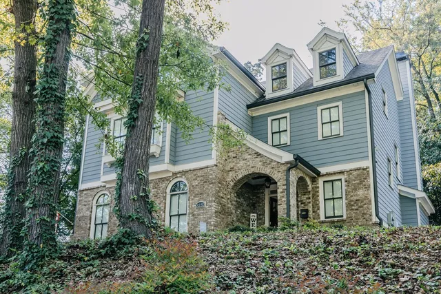 a front view of a house with garden