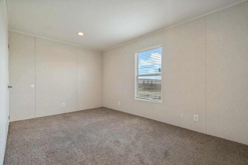 750 Conchas Street Kyle, TX 78640 - Photo 11 of 12 a view of an empty room with a window
