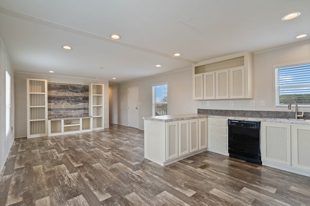 750 Conchas Street Kyle, TX 78640 - Photo 6 of 12 a view of kitchen with granite countertop cabinets and sink