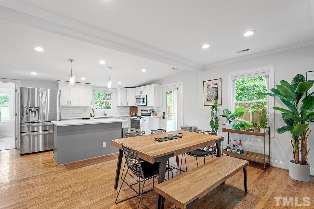 2214 Glascock Street Raleigh, NC 27610 - Photo 11 of 36 a kitchen with a table and chairs in it