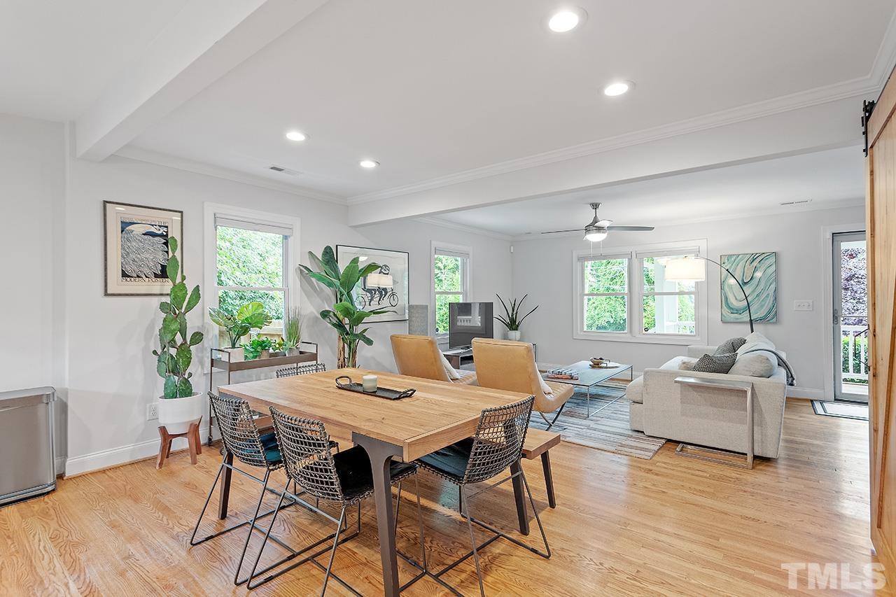 2214 Glascock Street Raleigh, NC 27610 - Photo 12 of 36 a view of a dining room with furniture window and wooden floor