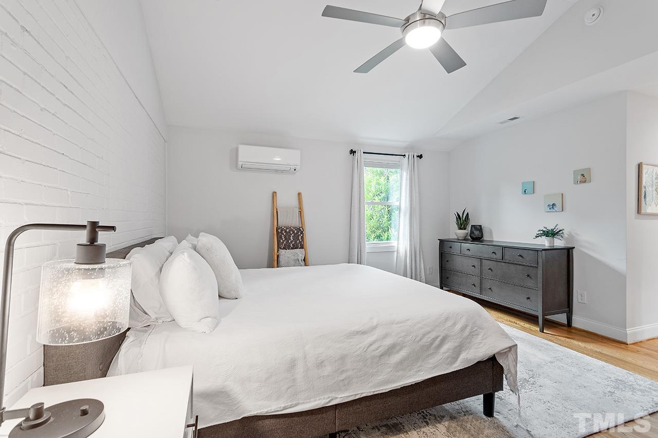 2214 Glascock Street Raleigh, NC 27610 - Photo 17 of 36 a bedroom with a bed and a dresser
