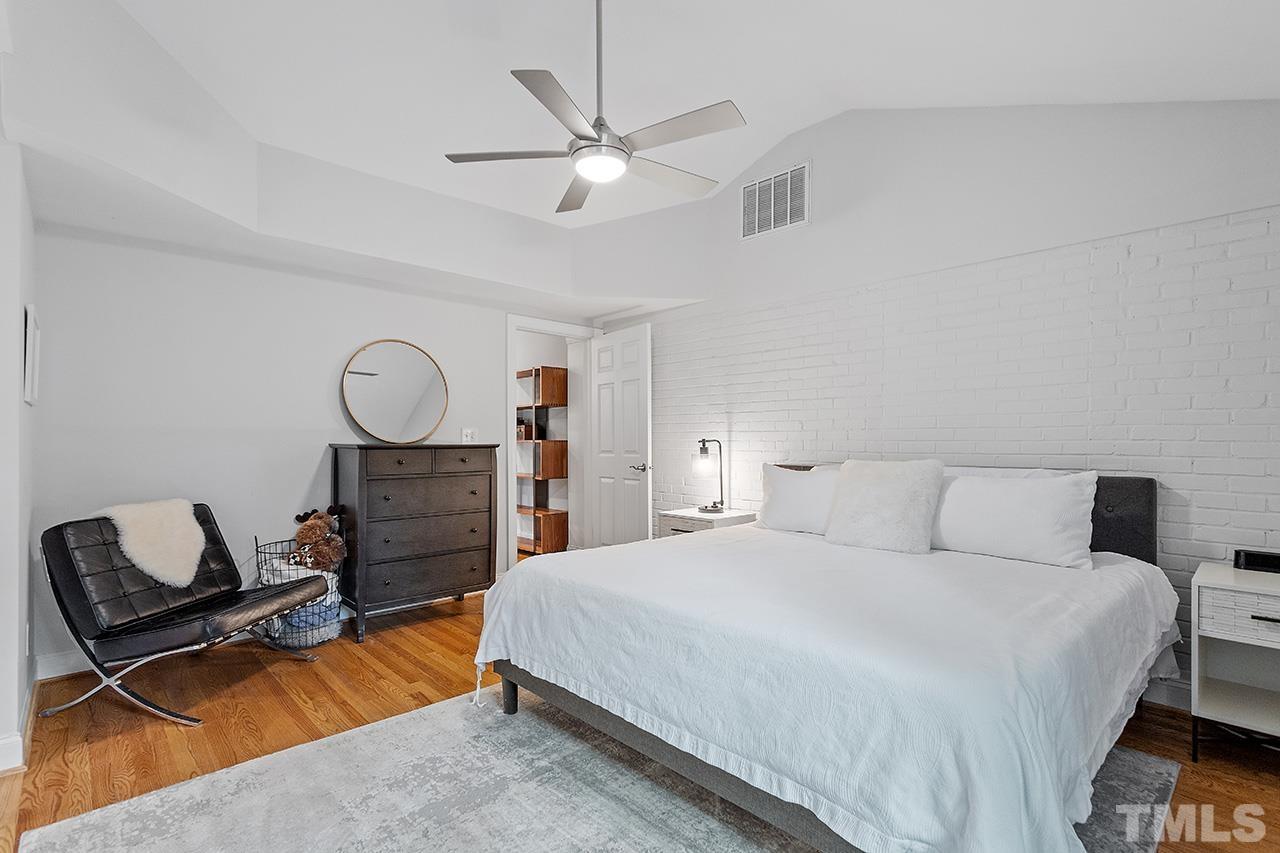 2214 Glascock Street Raleigh, NC 27610 - Photo 19 of 36 a bedroom with a bed and furniture