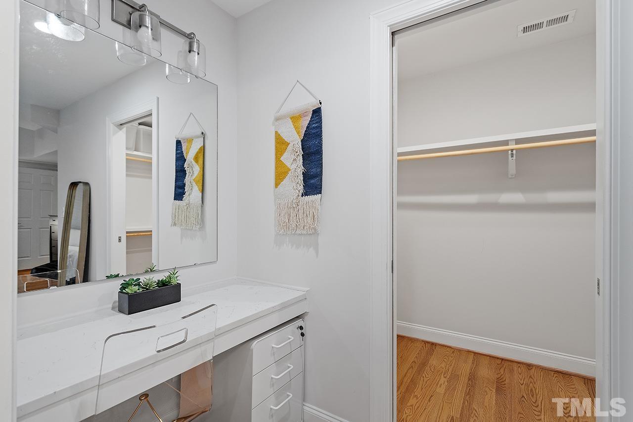 2214 Glascock Street Raleigh, NC 27610 - Photo 22 of 36 a bathroom with a sink and a mirror