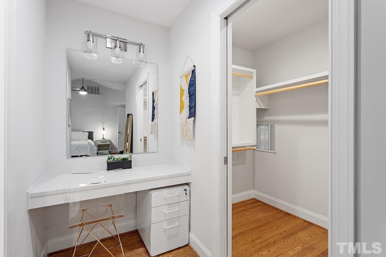 2214 Glascock Street Raleigh, NC 27610 - Photo 23 of 36 a bathroom with a sink and a mirror