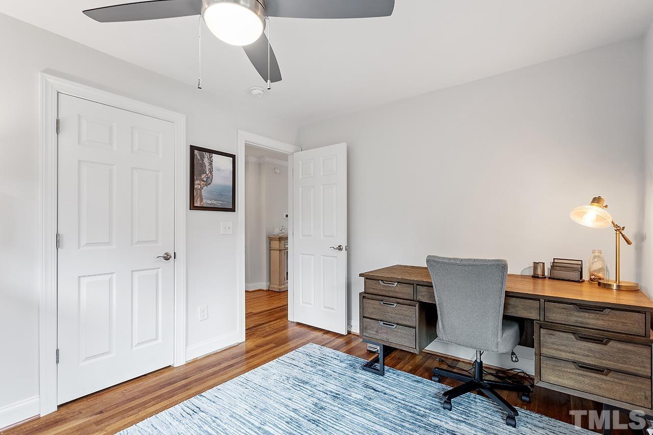 2214 Glascock Street Raleigh, NC 27610 - Photo 25 of 36 a workspace with furniture and wooden floor