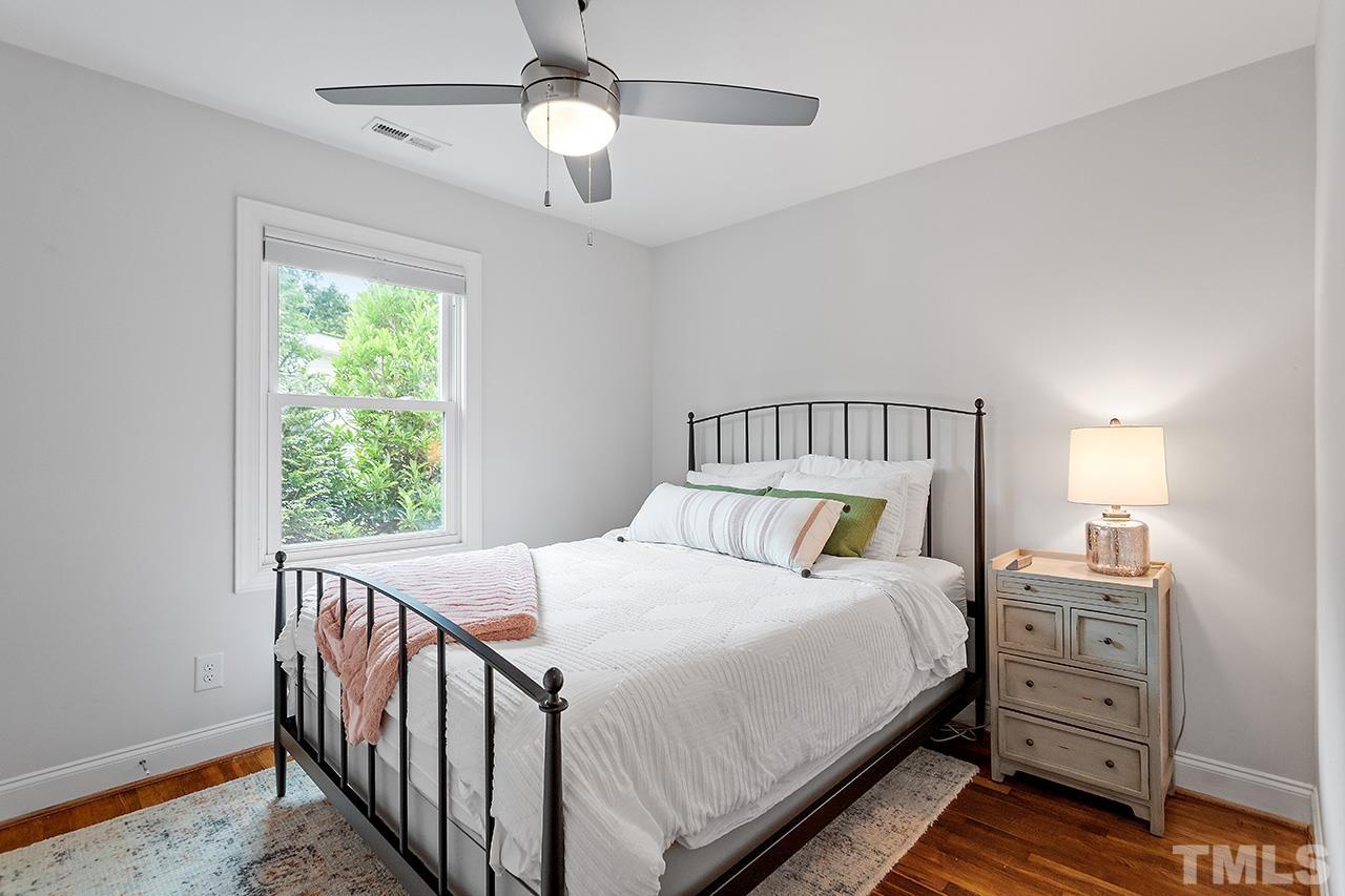 2214 Glascock Street Raleigh, NC 27610 - Photo 26 of 36 a bed sitting in a bedroom next to a window