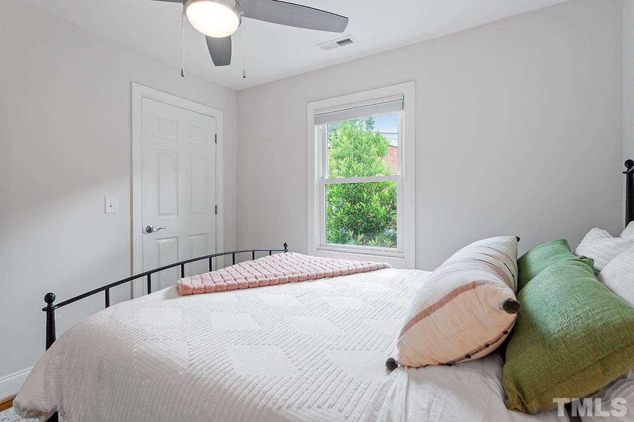 2214 Glascock Street Raleigh, NC 27610 - Photo 27 of 36 a bedroom with a bed and a window