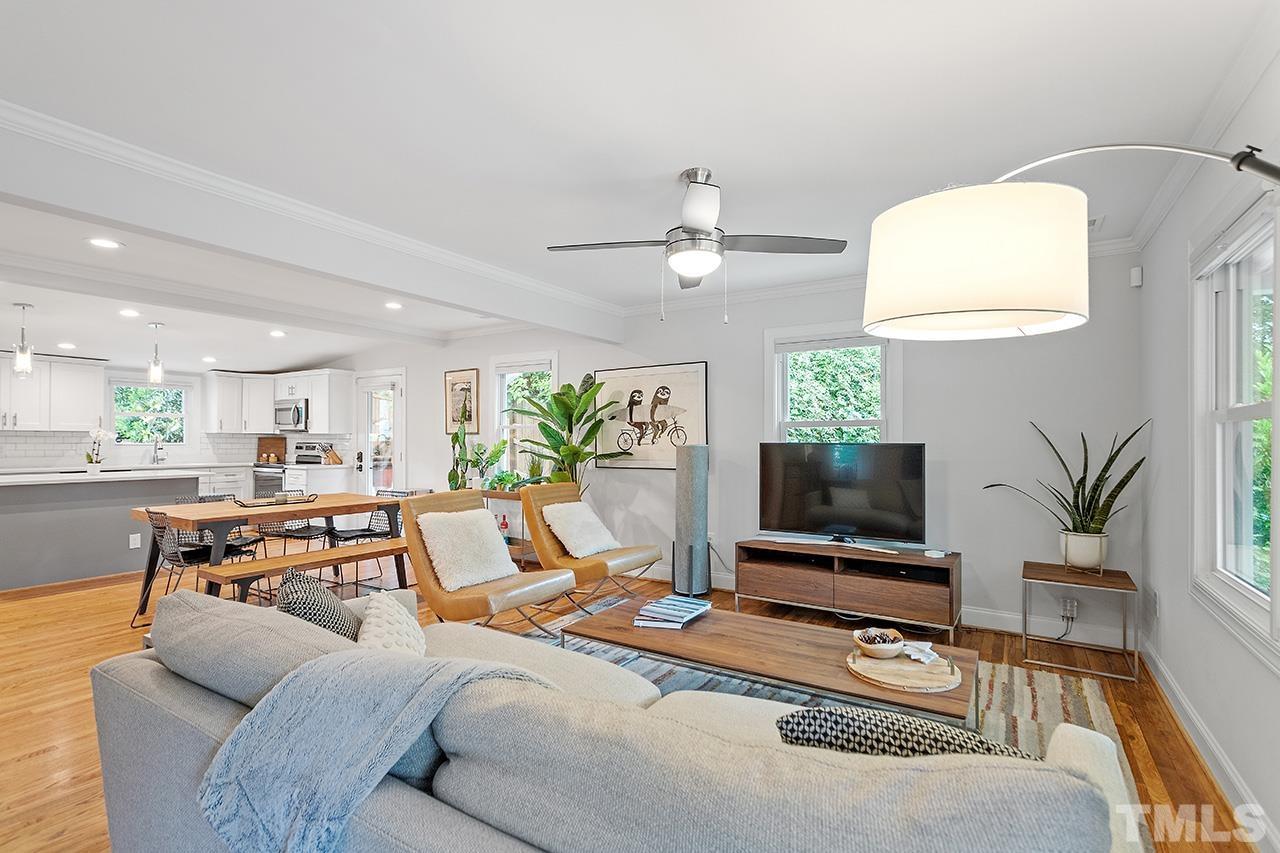 2214 Glascock Street Raleigh, NC 27610 - Photo 6 of 36 a living room with furniture and a flat screen tv