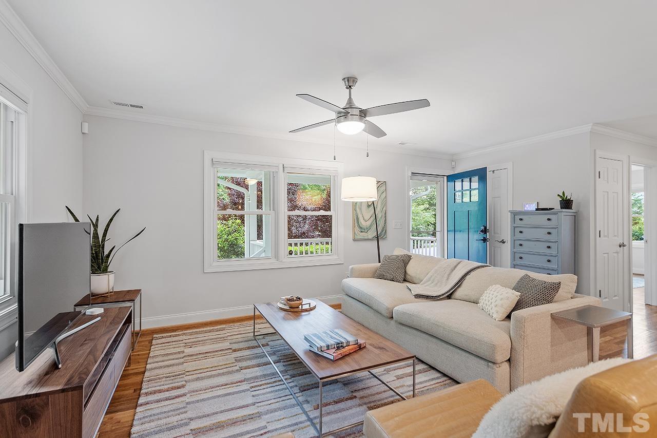 2214 Glascock Street Raleigh, NC 27610 - Photo 8 of 36 a living room with furniture and a flat screen tv
