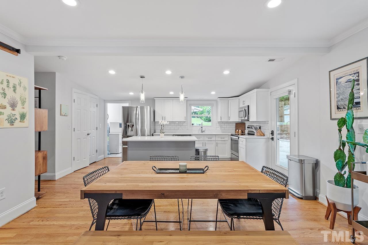 2214 Glascock Street Raleigh, NC 27610 - Photo 10 of 36 a view of a dining room with furniture and wooden floor