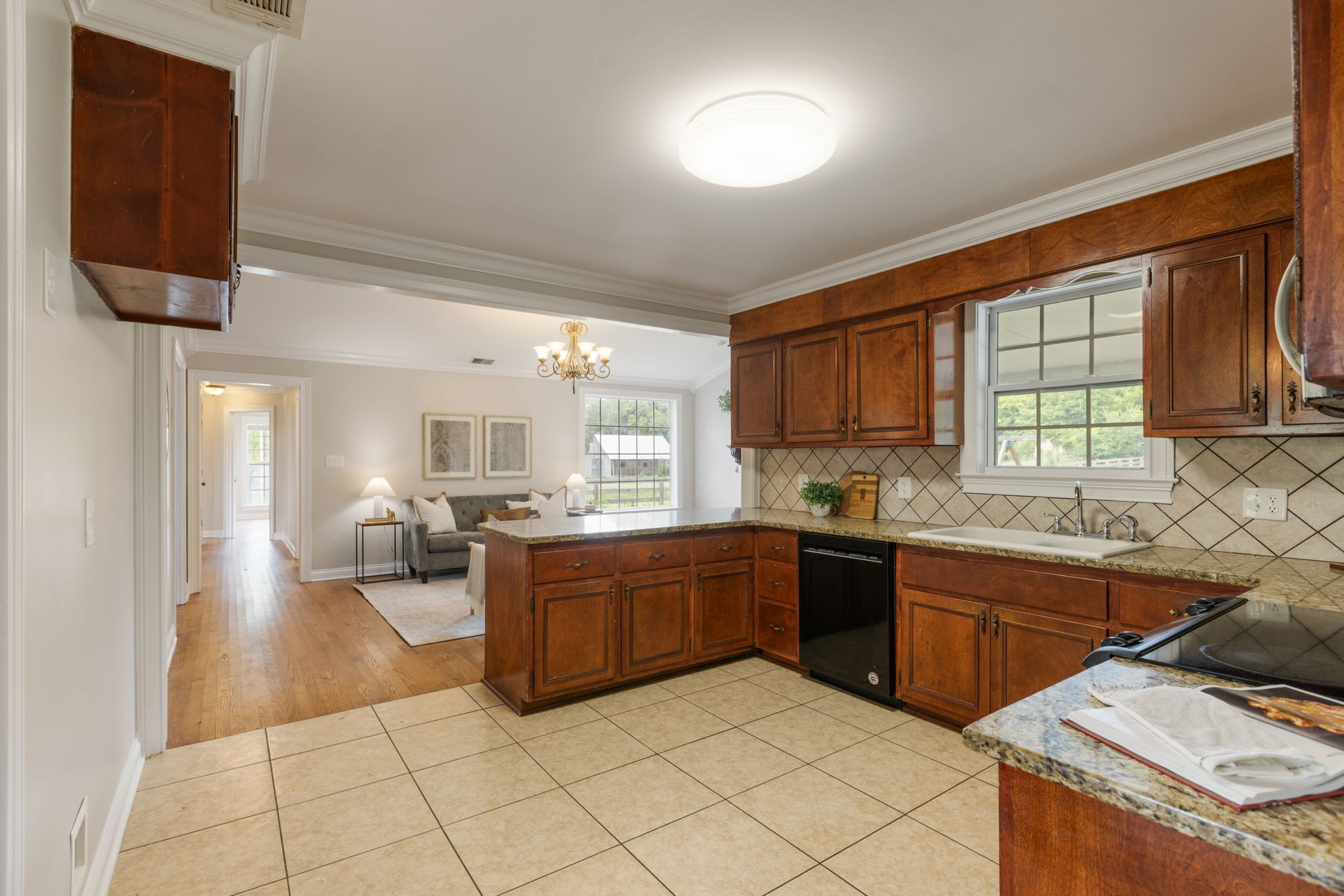 1586 Coleman Road Franklin, TN 37064 - Photo 13 of 73 a large kitchen with kitchen island granite countertop a sink counter top space and cabinets