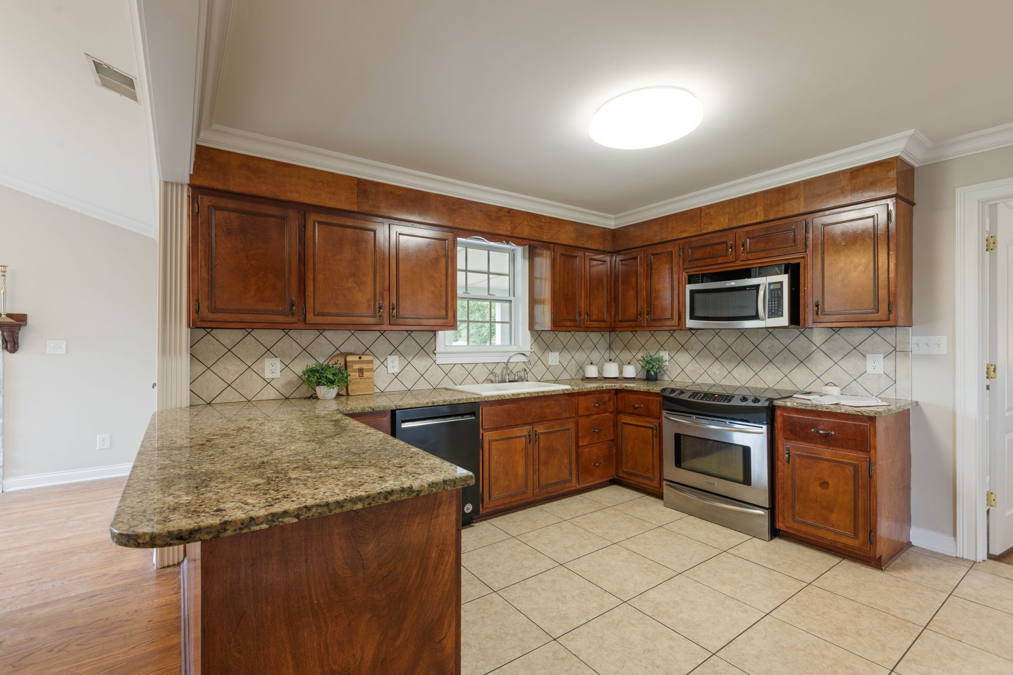 1586 Coleman Road Franklin, TN 37064 - Photo 14 of 73 a kitchen with granite countertop a sink and cabinets