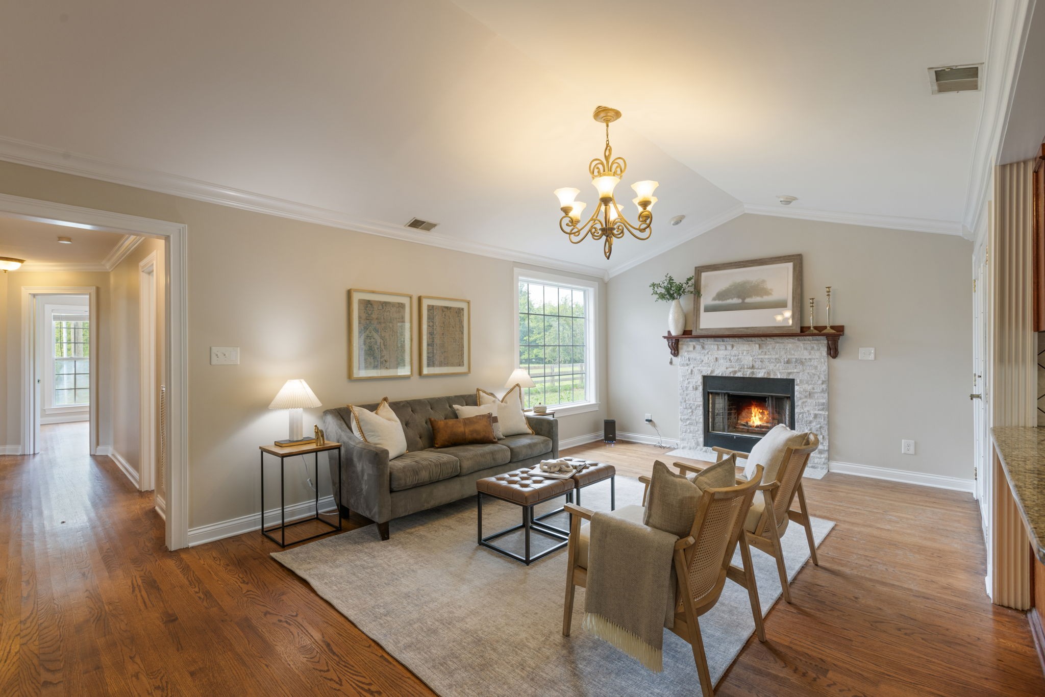 1586 Coleman Road Franklin, TN 37064 - Photo 15 of 73 a living room with furniture a fireplace and a chandelier