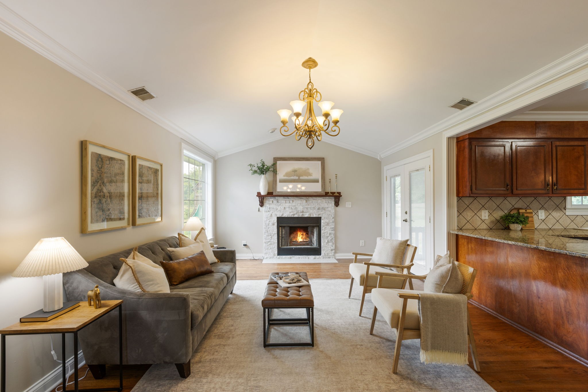 1586 Coleman Road Franklin, TN 37064 - Photo 17 of 73 a living room with furniture a fireplace and a chandelier