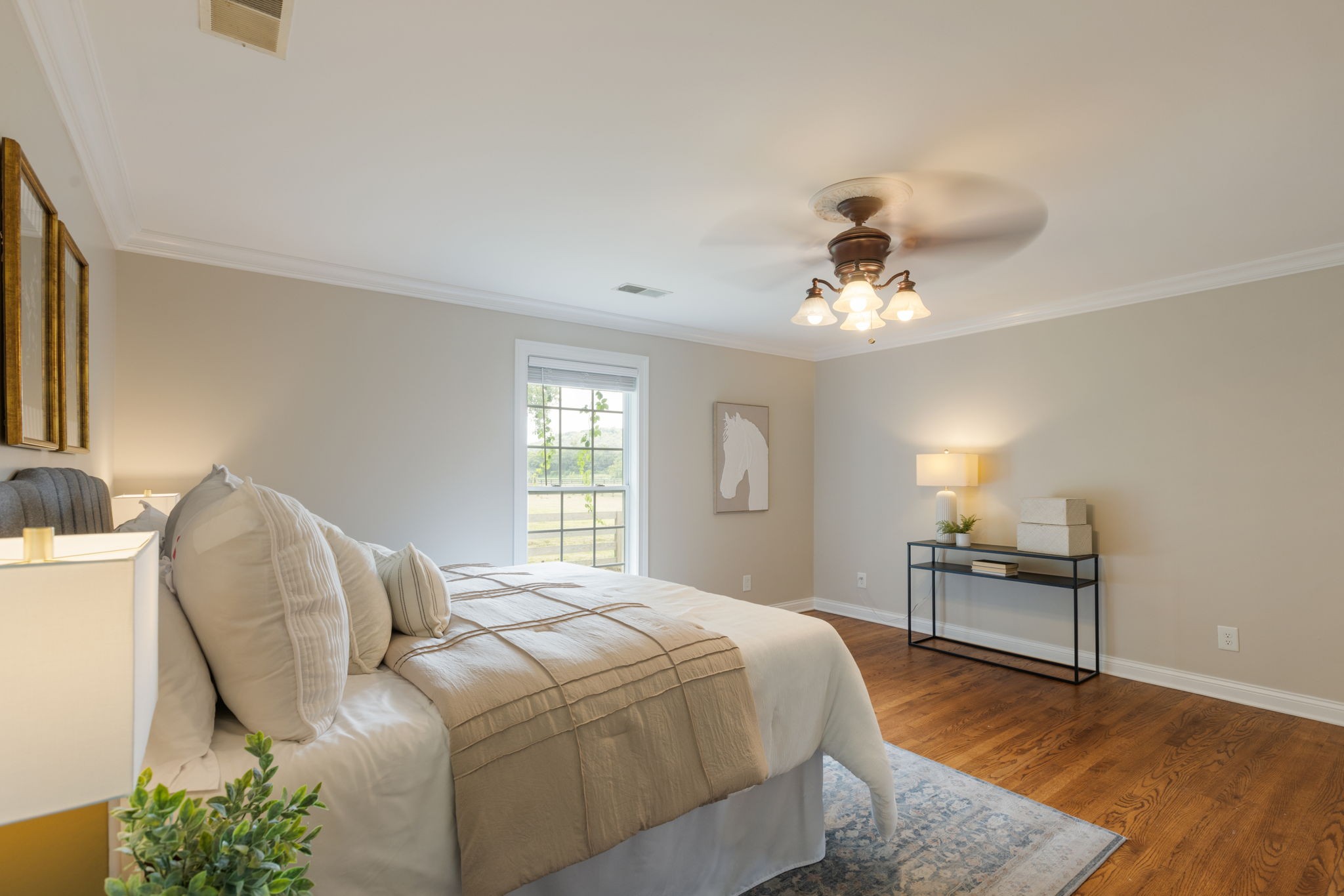 1586 Coleman Road Franklin, TN 37064 - Photo 20 of 73 a bedroom with a bed and a chandelier