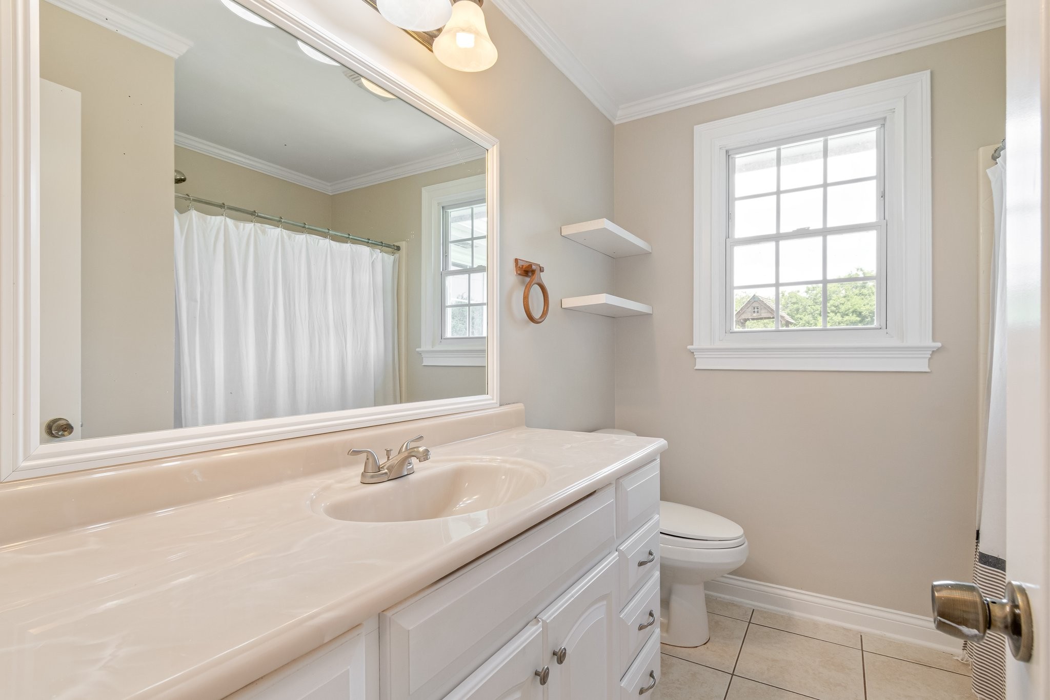 1586 Coleman Road Franklin, TN 37064 - Photo 23 of 73 a bathroom with a sink a toilet and a window