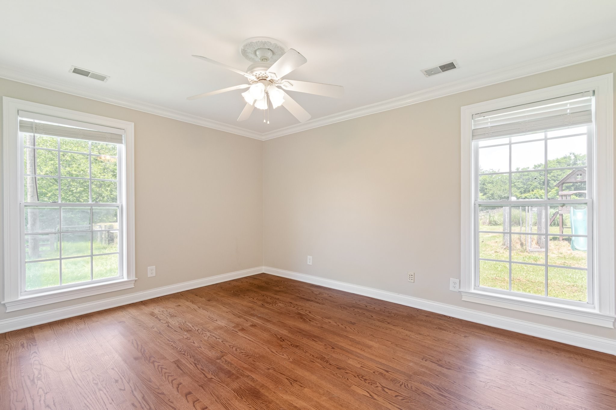 1586 Coleman Road Franklin, TN 37064 - Photo 25 of 73 a view of an empty room with wooden floor and a window