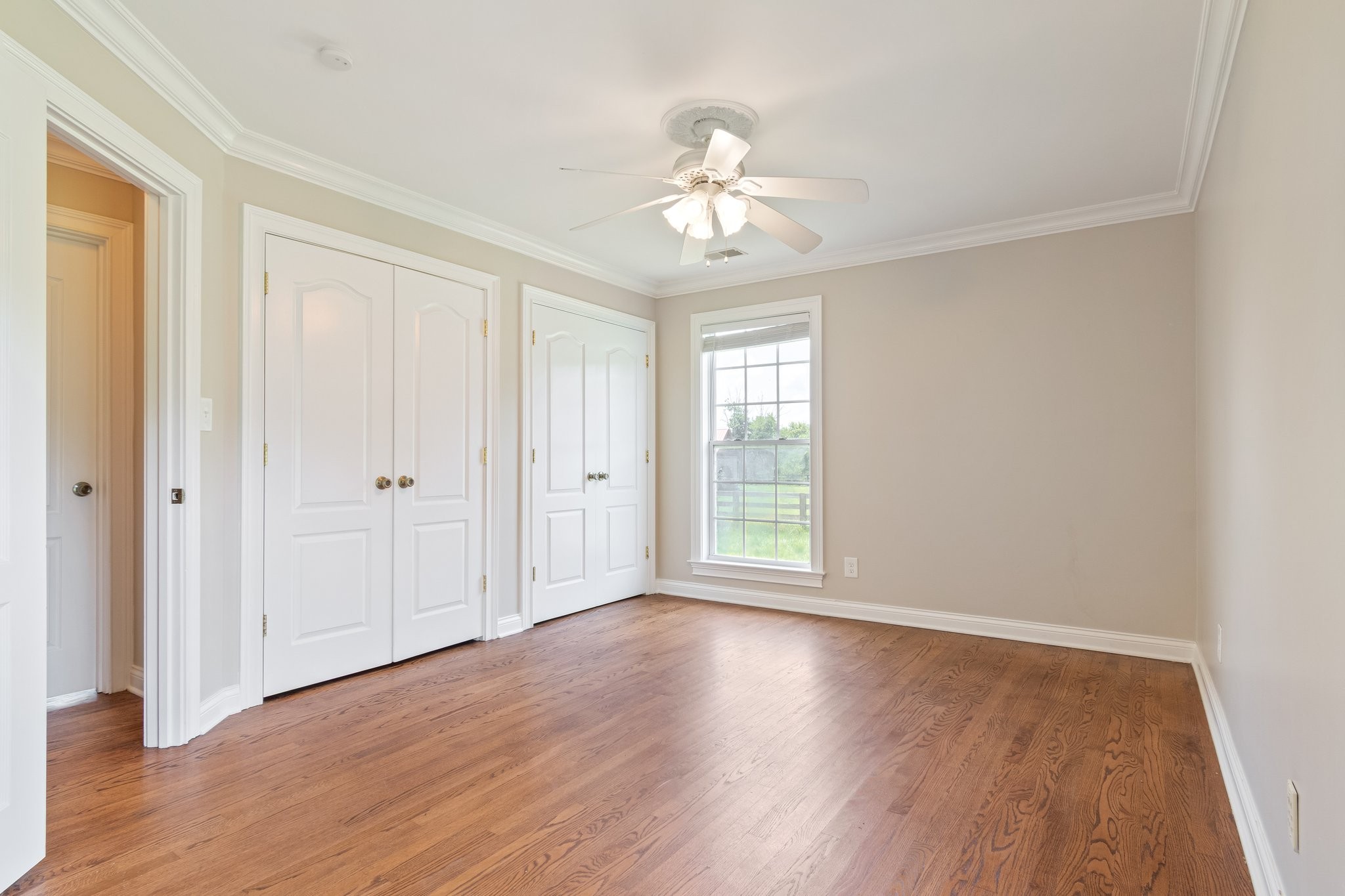 1586 Coleman Road Franklin, TN 37064 - Photo 28 of 73 a view of an empty room with wooden floor and a window