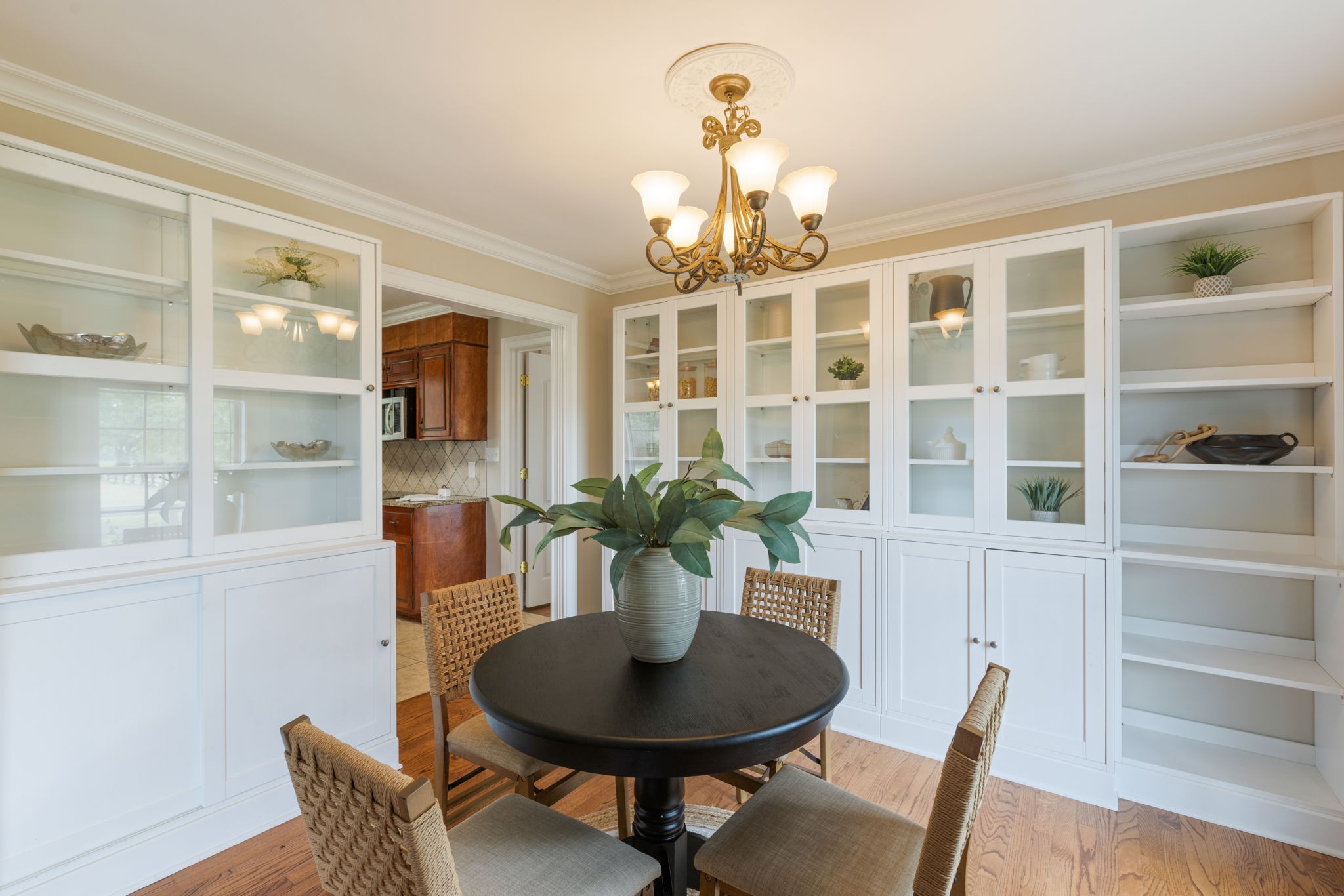1586 Coleman Road Franklin, TN 37064 - Photo 10 of 73 a dining room with furniture a potted plant and a chandelier