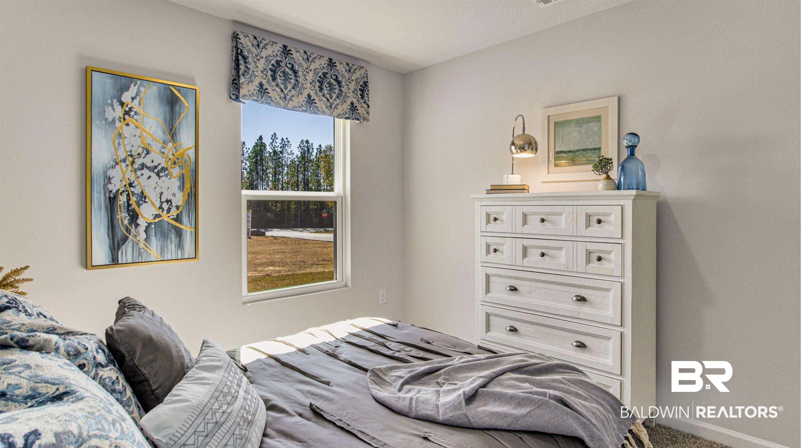 1040 Hayward Loop Foley, AL 36535 - Photo 25 of 35 Bright interior space with light gray walls, a large window, a patterned valance, and wall-to-wall carpeting